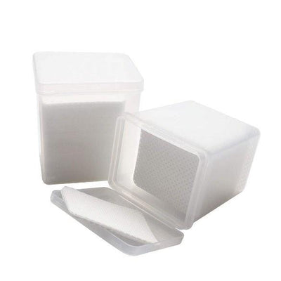 white adhesive wipes for lash glue in a plastic container