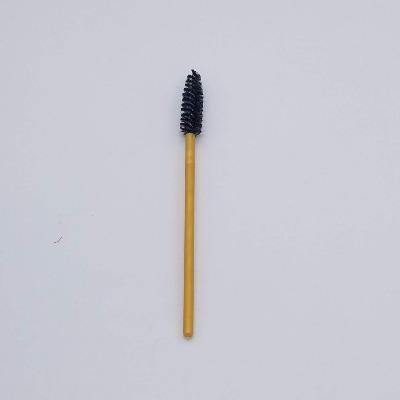 one mascara wand with black brush and gold handle